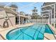 Inviting pool area with lanai, offering ample space for relaxation and entertaining at 7706 Water Oak Ct, Kissimmee, FL 34747