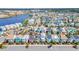 Colorful homes with a water view sit in a neatly planned community with parking at 8029 Sandy Toes Way, Kissimmee, FL 34747