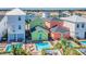 Aerial view highlighting the private pools and outdoor living spaces between the colorful homes at 8029 Sandy Toes Way, Kissimmee, FL 34747