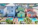 Aerial shot of colorful homes with private pools, surrounded by well-kept landscaping at 8029 Sandy Toes Way, Kissimmee, FL 34747