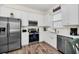 Bright, modern kitchen with stainless steel appliances and ample counter space at 8029 Sandy Toes Way, Kissimmee, FL 34747