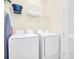 Convenient laundry room equipped with modern washer and dryer at 8029 Sandy Toes Way, Kissimmee, FL 34747