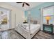Bedroom with king bed, ceiling fan, and a bright view at 8029 Sandy Toes Way, Kissimmee, FL 34747