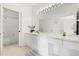 Bright bathroom features a large mirror, ample vanity space and a shower-tub combination at 8103 Coconut Palm Way # 204, Kissimmee, FL 34747