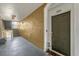 Condo hallway with door to unit 205, bench seating, and stairs at 8103 Coconut Palm Way # 204, Kissimmee, FL 34747