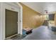 Condo hallway with door to unit 204, bench seating, and stairs at 8103 Coconut Palm Way # 204, Kissimmee, FL 34747
