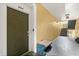 Condo hallway with door to unit 204, bench seating, and stairs at 8103 Coconut Palm Way # 204, Kissimmee, FL 34747