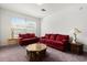 Bright living room featuring comfortable seating and a large window at 8103 Coconut Palm Way # 204, Kissimmee, FL 34747