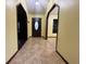 Bright entryway features tiled floors, decorative doorways, and dark wood front door with side lights at 8568 Park Highland Dr, Orlando, FL 32818