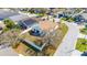 Aerial shot of a home with a fenced backyard, surrounded by green lawns and a neighborhood street at 919 Lake Charles Dr, Davenport, FL 33837