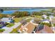Beautiful aerial view of homes and neighborhood near a lake with mature trees at 919 Lake Charles Dr, Davenport, FL 33837