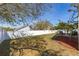Backyard featuring a patio area with seating and privacy fence at 919 Lake Charles Dr, Davenport, FL 33837