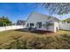 Spacious backyard featuring a patio area with seating and privacy fence at 919 Lake Charles Dr, Davenport, FL 33837