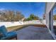 View of the backyard with a concrete patio and a white fence providing privacy at 919 Lake Charles Dr, Davenport, FL 33837