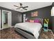 Spacious bedroom features modern flooring, ceiling fan and stylish decor at 919 Lake Charles Dr, Davenport, FL 33837