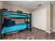 Bedroom featuring a bunk bed with tile flooring and white double door closet at 919 Lake Charles Dr, Davenport, FL 33837