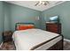 Cozy bedroom with ceiling fan, dresser, and comfortable bed at 919 Lake Charles Dr, Davenport, FL 33837