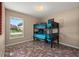 Bedroom featuring a bunk bed with tile flooring and a window providing natural light at 919 Lake Charles Dr, Davenport, FL 33837