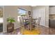 Bright breakfast nook features a wooden table and seating at 919 Lake Charles Dr, Davenport, FL 33837