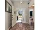 Inviting foyer with a welcoming front door, stylish tile flooring, and a glimpse of the bright outdoors at 919 Lake Charles Dr, Davenport, FL 33837
