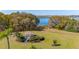 Scenic view of a lakeside gazebo surrounded by lush landscaping and walking paths at 919 Lake Charles Dr, Davenport, FL 33837
