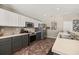 Updated kitchen featuring grey cabinets, stainless steel appliances, and stone countertops at 919 Lake Charles Dr, Davenport, FL 33837