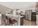 Modern kitchen with stainless steel appliances, breakfast bar, and white cabinets at 919 Lake Charles Dr, Davenport, FL 33837