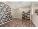 Spacious living area with geometric wall art and tile flooring, next to a comfortable lounge area at 919 Lake Charles Dr, Davenport, FL 33837