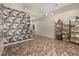 Open living space with stylish decor, including a geometric accent wall and shelving at 919 Lake Charles Dr, Davenport, FL 33837