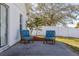 Patio area featuring two chairs and privacy fence at 919 Lake Charles Dr, Davenport, FL 33837