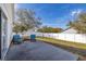 Patio area featuring two chairs and privacy fence at 919 Lake Charles Dr, Davenport, FL 33837