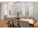 Bright dining room with a large wood table, seating for six, and a large window with shutters at 993 Everest, Clermont, FL 34711