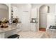 Bright kitchen with granite countertops, white cabinetry, and tile flooring at 993 Everest, Clermont, FL 34711