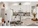 Bright kitchen features granite countertops, white cabinetry, stainless steel sink and modern appliances at 993 Everest, Clermont, FL 34711