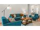 Bright living room featuring a sofa, comfortable chairs, and a stylish wooden coffee table at 993 Everest, Clermont, FL 34711