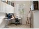 Bright office space with white cabinetry, a desk, and an easel in a well-lit area at 993 Everest, Clermont, FL 34711