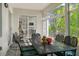 Enclosed patio area featuring a dining set, tiled floors, and exterior views at 993 Everest, Clermont, FL 34711