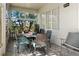 A cozy patio offers outdoor dining with comfortable seating and tranquil garden views at 993 Everest, Clermont, FL 34711