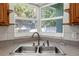 Kitchen sink with a large window view of the outdoors at 1102 Whitewood Dr, Deltona, FL 32725