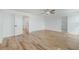 Spacious bedroom with wood-look floors, ceiling fan, and neutral paint palette at 1143 Seedorf Dr, Winter Haven, FL 33881