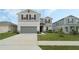 Charming two-story home with a well-maintained lawn and a two-car garage at 1143 Seedorf Dr, Winter Haven, FL 33881