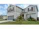 Beautiful home featuring a well-manicured lawn and a two-car garage at 1143 Seedorf Dr, Winter Haven, FL 33881