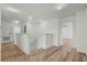 Upstairs hallway featuring wood-look floors and staircase at 1143 Seedorf Dr, Winter Haven, FL 33881