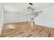 Bright living room featuring new wood flooring and modern light fixtures at 1143 Seedorf Dr, Winter Haven, FL 33881