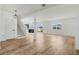 Open concept living space showcasing wood floors and seamless indoor/outdoor flow at 1143 Seedorf Dr, Winter Haven, FL 33881