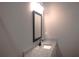 Modern bathroom featuring granite counters, mirror, and modern lighting at 1359 Greenfield Loop, Kissimmee, FL 34747