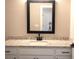 Bathroom featuring a vanity with granite countertop and black hardware at 1359 Greenfield Loop, Kissimmee, FL 34747