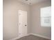 Bright bedroom featuring neutral walls, plush carpeting and bright window at 1359 Greenfield Loop, Kissimmee, FL 34747