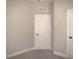 Bedroom featuring neutral walls, carpet, and two doors, offering flexibility for furniture arrangement at 1359 Greenfield Loop, Kissimmee, FL 34747