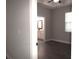 The bedroom features hardwood floors and a bright window, leading to an ensuite bathroom at 1359 Greenfield Loop, Kissimmee, FL 34747